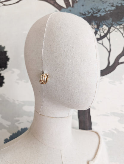 Boucles Arabesques oreilles percées