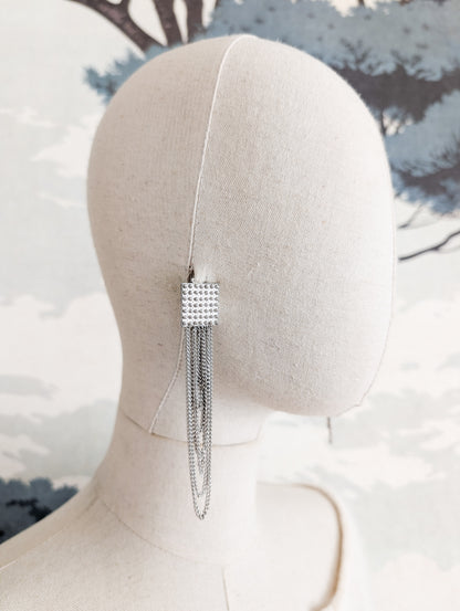 Longues boucles argentées américaines oreilles percées