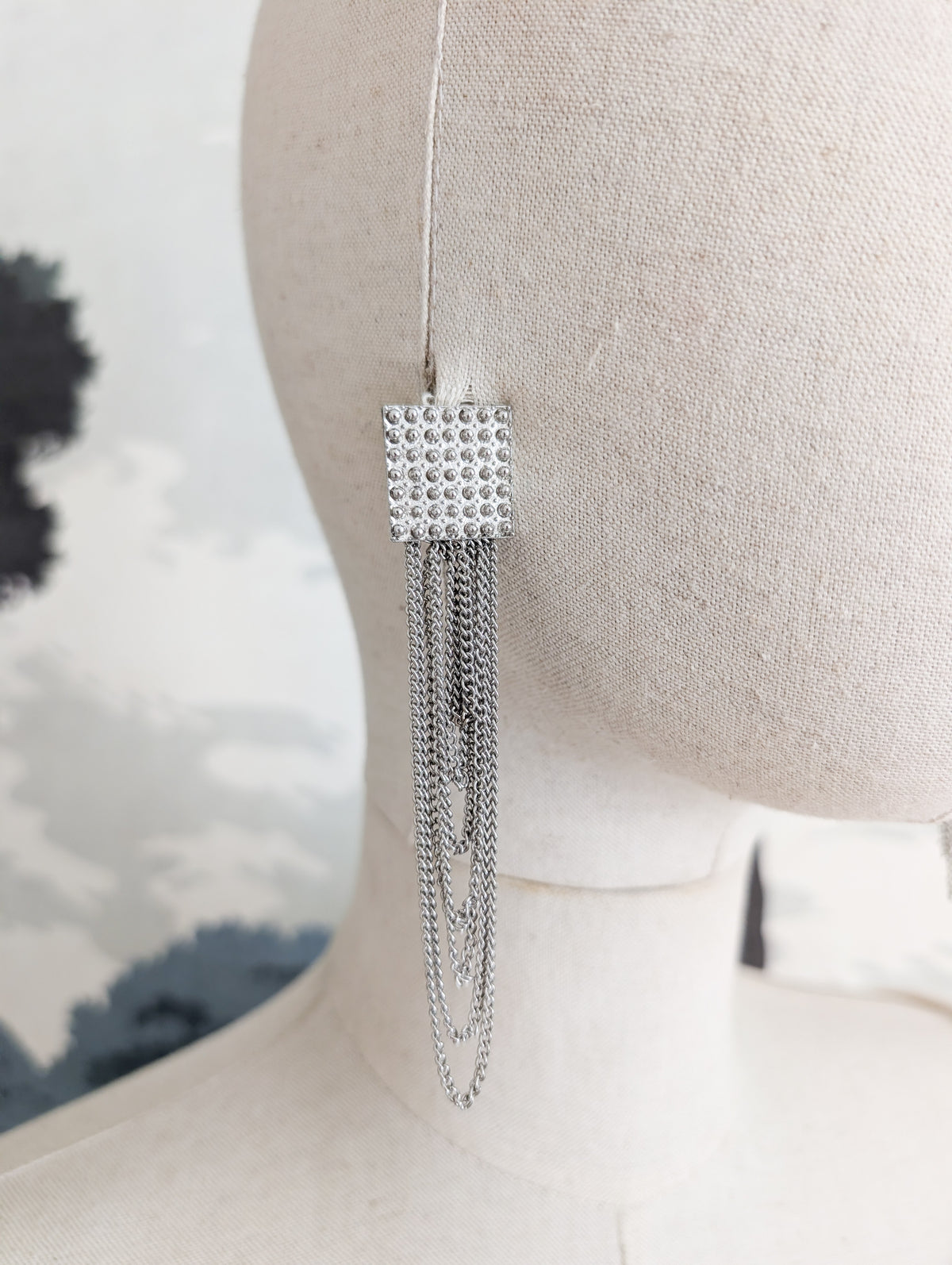 Longues boucles argentées américaines oreilles percées